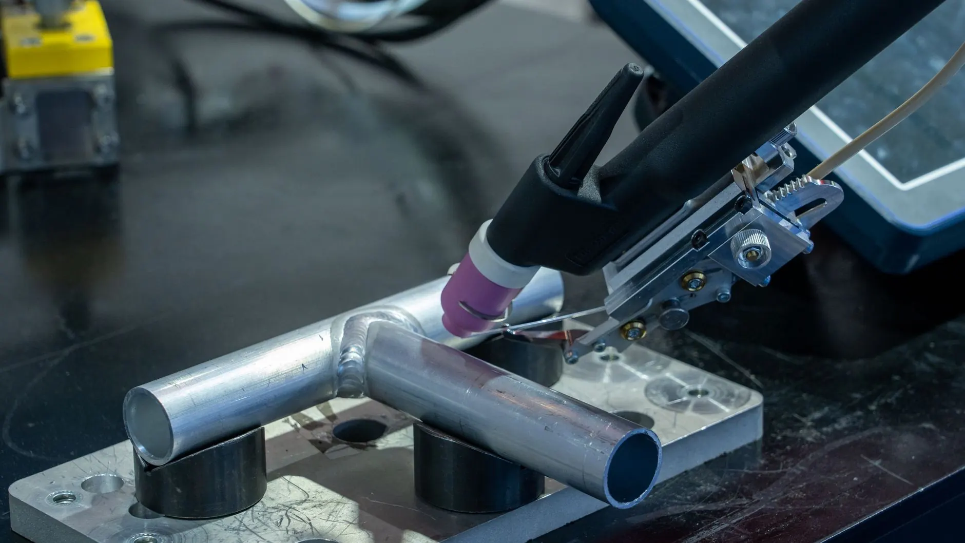 Aluminum gate section being TIG welded to resist coastal salt-air corrosion